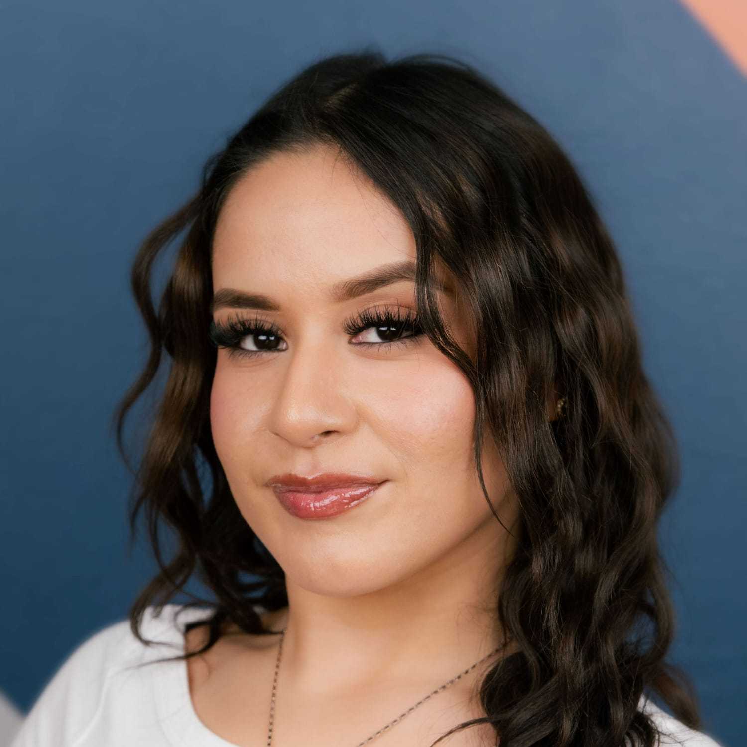 Portrait of Jakelyne, a professional stylist at Mitchell & Co. Salon and Spa, showcasing their expertise and style.