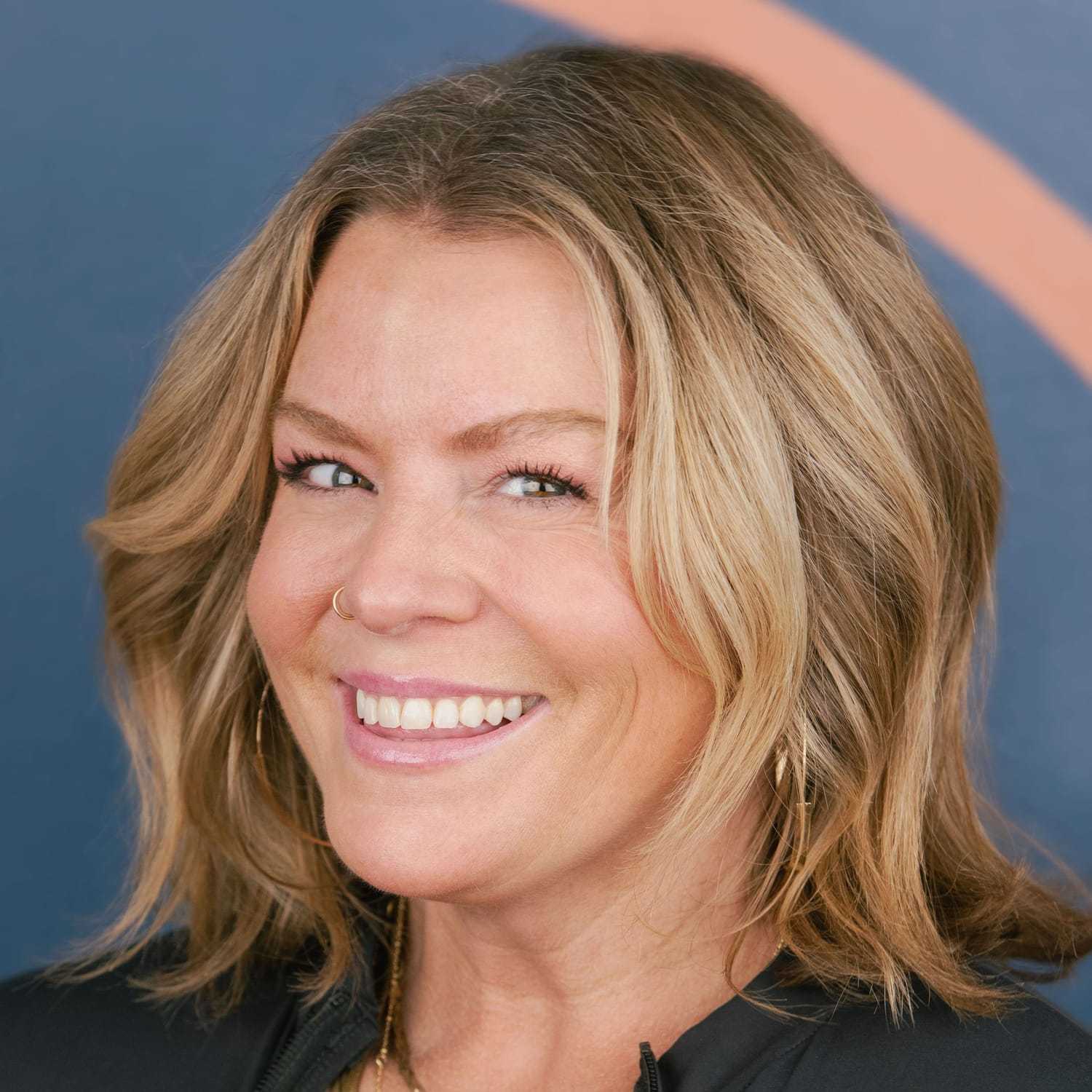 Portrait of Bobbi Mitchell, a professional stylist at Mitchell & Co. Salon and Spa, showcasing their expertise and style.