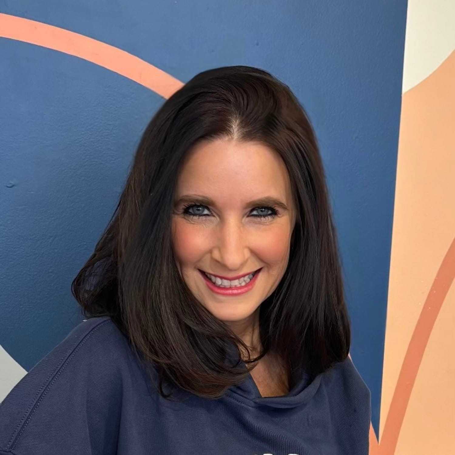 Portrait of Christy Tentori, a professional stylist at Mitchell & Co. Salon and Spa, showcasing their expertise and style.